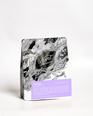 Novelt coffee package with black and white design and purple label on a white background